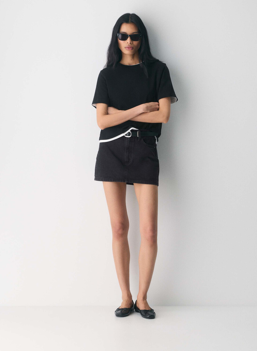 denim forum the 90s ricci denim skirt black eyeliner