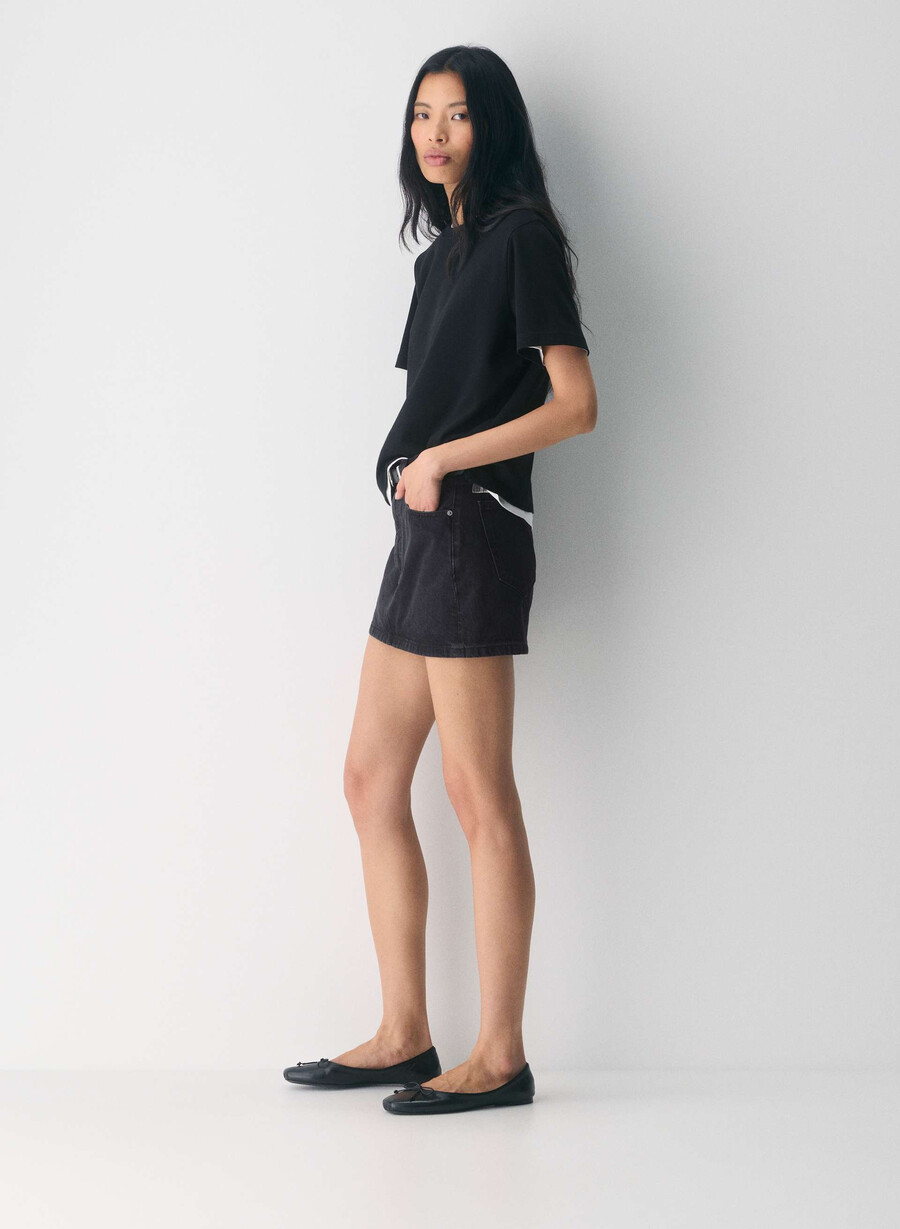 denim forum the 90s ricci denim skirt black eyeliner