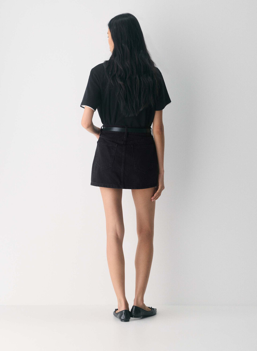 denim forum the 90s ricci denim skirt black eyeliner
