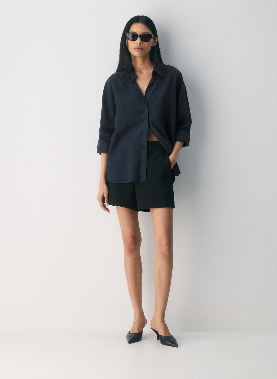 new agency mid-thigh short black