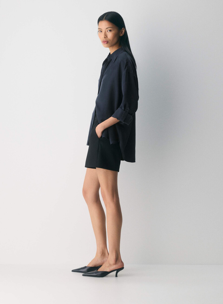 new agency mid-thigh short black