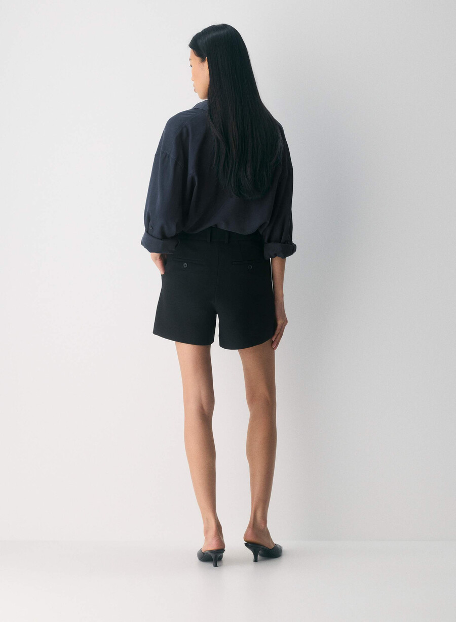 new agency mid-thigh short black