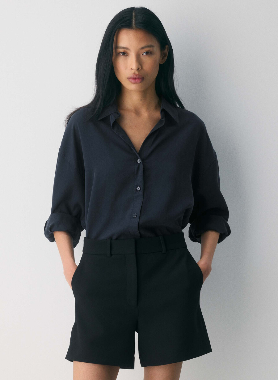 new agency mid-thigh short black